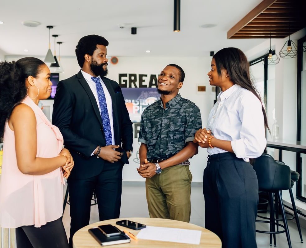 Young African marketing professionals collaborating in a Lagos office